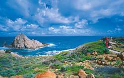 Sugarloaf Rock, Leeuwin-Naturaliste NP. People standing at a lookout.