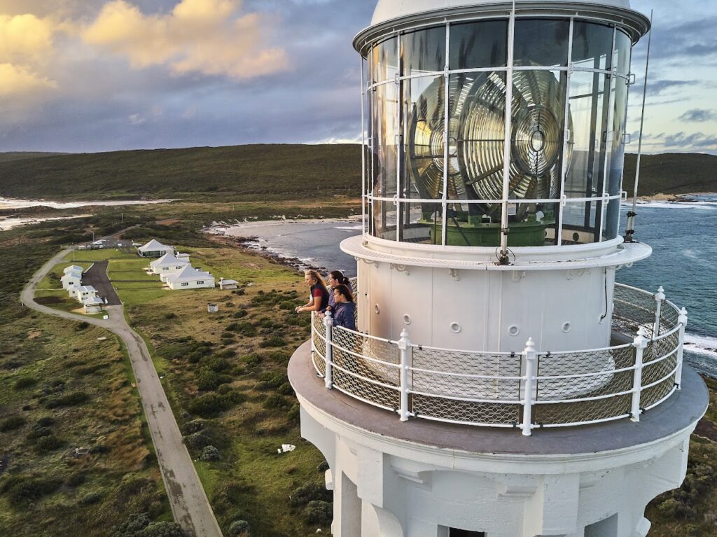 Cape Leeuwin Lighthouse with two people standing at the top.